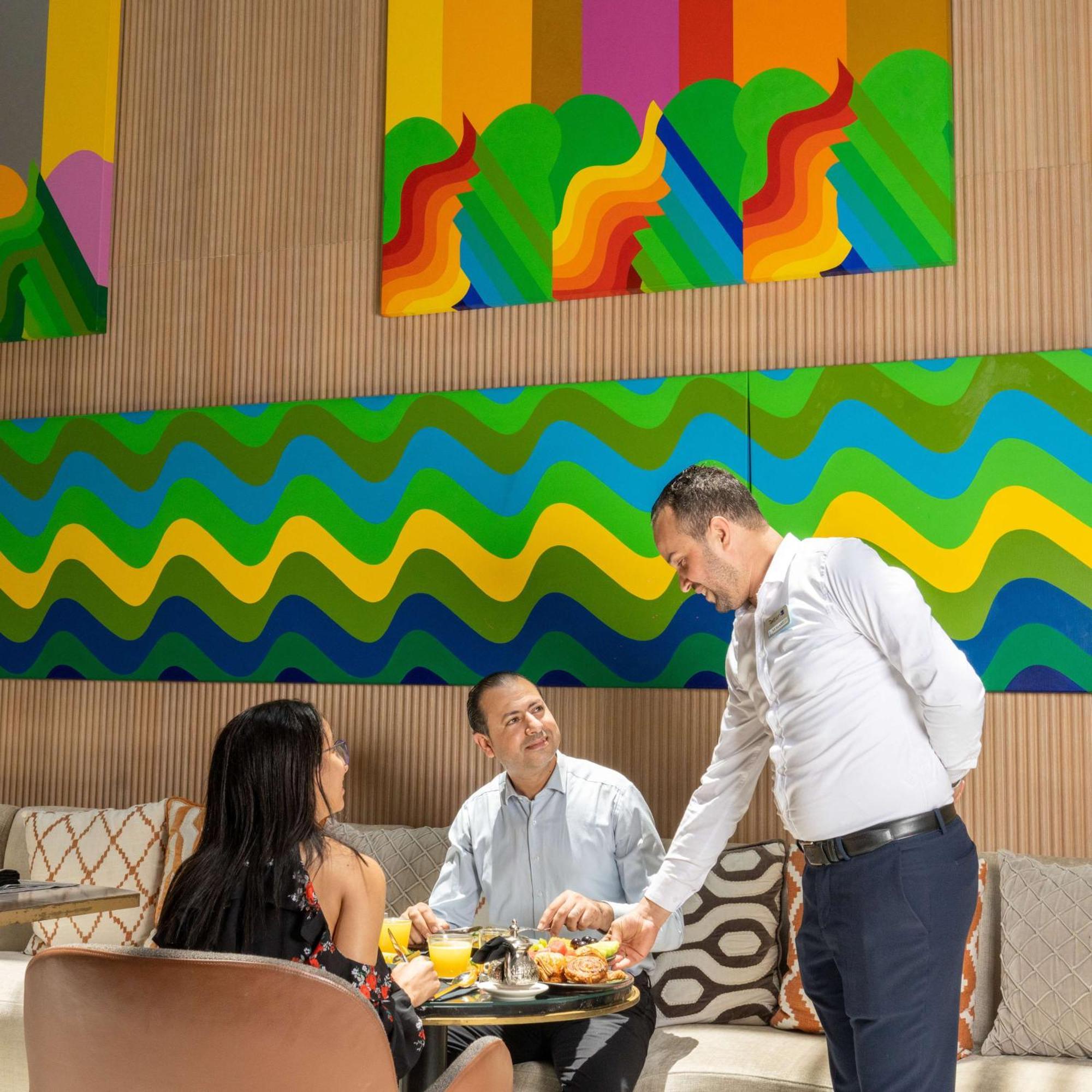 Radisson Blu Hotel Casablanca City Center Εξωτερικό φωτογραφία A waiter serving guests at a restaurant